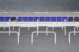 SUNBURY, ENGLAND - FEBRUARY 09: Empty grandstand with a 'come and join us' sign at Kempton Park Racecourse on February 09, 2021 in Sunbury, England. Due to the Coronavirus pandemic, owners along with the paying public will not be allowed to attend the meeting. (Photo by Alan Crowhurst/Getty Images)