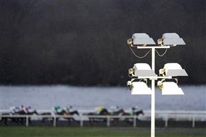 SUNBURY, ENGLAND - FEBRUARY 09: A general view as snowflakes fall at Kempton Park Racecourse on February 09, 2021 in Sunbury, England. Due to the Coronavirus pandemic, owners along with the paying public will not be allowed to attend the meeting. (Photo by Alan Crowhurst/Getty Images)