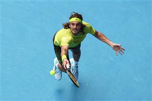 MELBOURNE, AUSTRALIA - FEBRUARY 11: Stefanos Tsitsipas of Greece plays a backhand in his Men