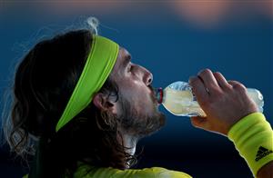 MELBOURNE, AUSTRALIA - FEBRUARY 11: Stefanos Tsitsipas of Greece has a drink between games in his Men