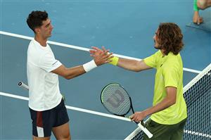 MELBOURNE, AUSTRALIA - FEBRUARY 11: Stefanos Tsitsipas of Greece and Thanasi Kokkinakis of Australia embrace at the net following their Men