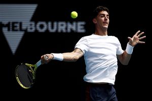 MELBOURNE, AUSTRALIA - FEBRUARY 11: Thanasi Kokkinakis of Australia plays a forehand in his Men