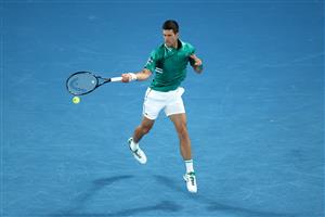 MELBOURNE, AUSTRALIA - FEBRUARY 16: Novak Djokovic of Serbia plays a forehand in his Men