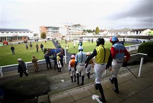 WETHERBY, ENGLAND - FEBRUARY 17: Jockeys make their way out from the changing rooms ahead of the BoscaSports Racings Digital Display Handicap Hurdle at Wetherby Racecourse on February 17, 2021 in Wetherby, England. (Photo by Tim Goode-Pool/Getty Images)