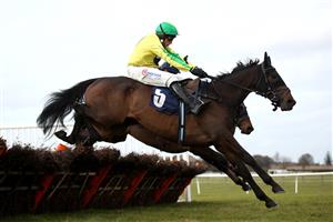 WETHERBY, ENGLAND - FEBRUARY 17: Embole ridden by Harry Skelton clears a fence on their way to winning the BoscaSports Racings Digital Display Handicap Hurdle at Wetherby Racecourse on February 17, 2021 in Wetherby, England. (Photo by Tim Goode-Pool/Getty Images)