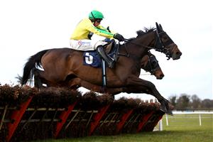 WETHERBY, ENGLAND - FEBRUARY 17: Embole ridden by Harry Skelton clears a fence on their way to winning the BoscaSports Racings Digital Display Handicap Hurdle at Wetherby Racecourse on February 17, 2021 in Wetherby, England. (Photo by Tim Goode-Pool/Getty Images)