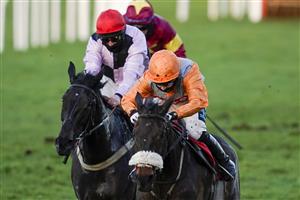 ESHER, ENGLAND - FEBRUARY 18: Millie Wonnacott riding Conkwell Legend (orange) bypass the hurdles in the straight before winning The Richmond Novices' Handicap Hurdle at Sandown Park Racecourse on February 18, 2021 in Esher, England. Due to the coronavirus pandemic, owners along with the paying public will not be allowed to attend the meeting. (Photo by Alan Crowhurst/Getty Images)