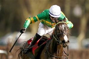 ESHER, ENGLAND - FEBRUARY 18: Niall Houlihan riding Belargus clear the last to win The Elmbridge Handicap Chase at Sandown Park Racecourse on February 18, 2021 in Esher, England. Due to the coronavirus pandemic, owners along with the paying public will not be allowed to attend the meeting. (Photo by Alan Crowhurst/Getty Images)