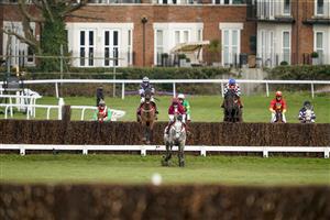 ESHER, ENGLAND - FEBRUARY 18: A general view as runners clear the first fence during The Elmbridge Handicap Chase at Sandown Park Racecourse on February 18, 2021 in Esher, England. Due to the coronavirus pandemic, owners along with the paying public will not be allowed to attend the meeting. (Photo by Alan Crowhurst/Getty Images)