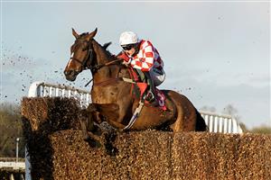 ESHER, ENGLAND - FEBRUARY 18: Tom Bellamy riding Eclair Surf on their way to winning The Littleworth Handicap Chase at Sandown Park Racecourse on February 18, 2021 in Esher, England. Due to the coronavirus pandemic, owners along with the paying public will not be allowed to attend the meeting. (Photo by Alan Crowhurst/Getty Images)