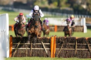 ESHER, ENGLAND - FEBRUARY 18: Fergus Gillard riding Eamon An Cnoic clear the las to win The Greenwich Conditional Jockeys' Handicap Hurdle at Sandown Park Racecourse on February 18, 2021 in Esher, England. Due to the coronavirus pandemic, owners along with the paying public will not be allowed to attend the meeting. (Photo by Alan Crowhurst/Getty Images)