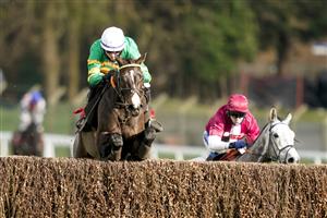 ESHER, ENGLAND - FEBRUARY 18: Niall Houlihan riding Belargus clear the last to win The Elmbridge Handicap Chase at Sandown Park Racecourse on February 18, 2021 in Esher, England. Due to the coronavirus pandemic, owners along with the paying public will not be allowed to attend the meeting. (Photo by Alan Crowhurst/Getty Images)