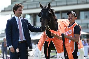 MELBOURNE, AUSTRALIA - FEBRUARY 20: Trainer Sam Freedman poses with Artorius after winning Race 7, the Neds Blue Diamond Stakes, during Blue Diamond Stakes Day at Caulfield Racecourse on February 20, 2021 in Melbourne, Australia. (Photo by Vince Caligiuri/Getty Images)