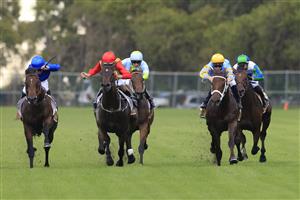 SYDNEY, AUSTRALIA - FEBRUARY 20: Rachel King on Andermatt (blue) wins race 1 the Chandon Handicap with favourite James McDonald (yellow cap) on Vovmaster unplaced during Sydney Racing at Rosehill Gardens on February 20, 2021 in Sydney, Australia. (Photo by Mark Evans/Getty Images)
