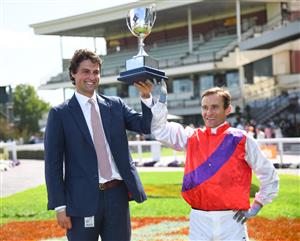 MELBOURNE, AUSTRALIA - FEBRUARY 20: Trainer Sam Freedman and Luke Currie pose with the trophy after Artorius won Race 7, the Neds Blue Diamond Stakes, during Blue Diamond Stakes Day at Caulfield Racecourse on February 20, 2021 in Melbourne, Australia. (Photo by Vince Caligiuri/Getty Images)