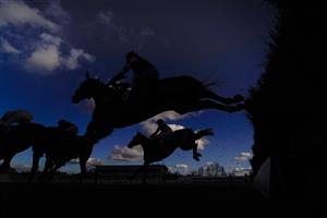WARWICK, ENGLAND - FEBRUARY 26: A general view as runners clear a fence in the straight during The Watch On Racing TV Novices' Handicap Chase at Warwick Racecourse on February 26, 2021 in Warwick, England. Due to the coronavirus pandemic, owners along with the paying public will not be allowed to attend the meeting. (Photo by Alan Crowhurst/Getty Images)