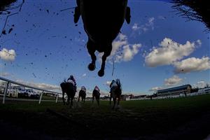 WARWICK, ENGLAND - FEBRUARY 26: A general view as runners clear a fence in the straight during The Watch On Racing TV Novices' Handicap Chase at Warwick Racecourse on February 26, 2021 in Warwick, England. Due to the coronavirus pandemic, owners along with the paying public will not be allowed to attend the meeting. (Photo by Alan Crowhurst/Getty Images)
