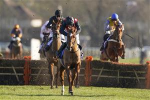 SUNBURY, ENGLAND - FEBRUARY 27: Jonjo O'Neill Jr riding Cape Gentleman (red/black) clear the last to win The Sky Bet Dovecote Novices' Hurdle at Kempton Park Racecourse on February 27, 2021 in Sunbury, England. Due to the coronavirus pandemic, owners along with the paying public will not be allowed to attend the meeting. (Photo by Alan Crowhurst/Getty Images)
