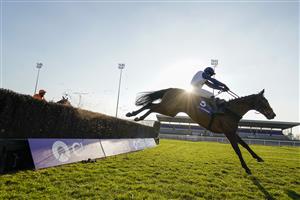 SUNBURY, ENGLAND - FEBRUARY 27: Jonathan Burke riding Clondaw Castle clear the last to win The Close Brothers Handicap Chase at Kempton Park Racecourse on February 27, 2021 in Sunbury, England. Due to the coronavirus pandemic, owners along with the paying public will not be allowed to attend the meeting. (Photo by Alan Crowhurst/Getty Images)
