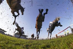 SUNBURY, ENGLAND - FEBRUARY 27: Action as runners clear a fence in the straight during The Close Brothers Handicap Chase at Kempton Park Racecourse on February 27, 2021 in Sunbury, England. Due to the coronavirus pandemic, owners along with the paying public will not be allowed to attend the meeting. (Photo by Alan Crowhurst/Getty Images)