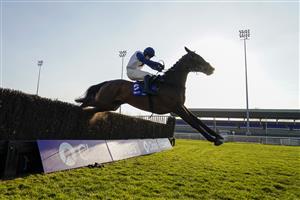 SUNBURY, ENGLAND - FEBRUARY 27: Jonathan Burke riding Clondaw Castle clear the last to win The Close Brothers Handicap Chase at Kempton Park Racecourse on February 27, 2021 in Sunbury, England. Due to the coronavirus pandemic, owners along with the paying public will not be allowed to attend the meeting. (Photo by Alan Crowhurst/Getty Images)