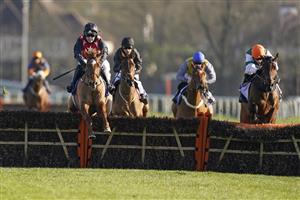SUNBURY, ENGLAND - FEBRUARY 27: Jonjo O'Neill Jr riding Cape Gentleman (red/black) clear the last to win The Sky Bet Dovecote Novices' Hurdle at Kempton Park Racecourse on February 27, 2021 in Sunbury, England. Due to the coronavirus pandemic, owners along with the paying public will not be allowed to attend the meeting. (Photo by Alan Crowhurst/Getty Images)