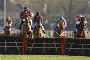 SUNBURY, ENGLAND - FEBRUARY 27: Jonjo O'Neill Jr riding Cape Gentleman (red/black) clear the last to win The Sky Bet Dovecote Novices' Hurdle at Kempton Park Racecourse on February 27, 2021 in Sunbury, England. Due to the coronavirus pandemic, owners along with the paying public will not be allowed to attend the meeting. (Photo by Alan Crowhurst/Getty Images)