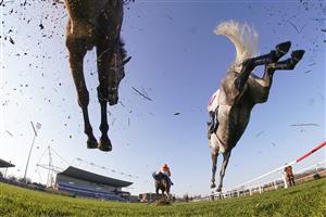 SUNBURY, ENGLAND - FEBRUARY 27: Action as runners clear a fence in the straight during The Close Brothers Handicap Chase at Kempton Park Racecourse on February 27, 2021 in Sunbury, England. Due to the coronavirus pandemic, owners along with the paying public will not be allowed to attend the meeting. (Photo by Alan Crowhurst/Getty Images)
