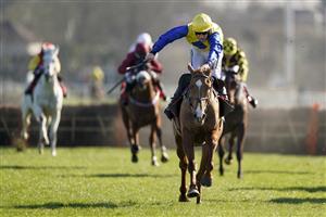 SUNBURY, ENGLAND - FEBRUARY 27: Ciaran Gethings riding Hometown Boy clear the last to win The Close Brothers Asset Finance Handicap Hurdle at Kempton Park Racecourse on February 27, 2021 in Sunbury, England. Due to the coronavirus pandemic, owners along with the paying public will not be allowed to attend the meeting. (Photo by Alan Crowhurst/Getty Images)