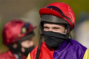 SUNBURY, ENGLAND - FEBRUARY 27: Tom Scudamore on his way to the parade ring at Kempton Park Racecourse on February 27, 2021 in Sunbury, England. Due to the coronavirus pandemic, owners along with the paying public will not be allowed to attend the meeting. (Photo by Alan Crowhurst/Getty Images)