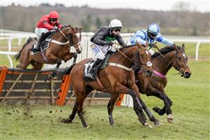 NEWBURY, ENGLAND - MARCH 06: Tom Buckley riding Always Resolute (C, white cap) clear the last to win The BetVictor Seniors' Handicap Hurdle at Newbury Racecourse on March 06, 2021 in Newbury, England. Due to the coronavirus pandemic, owners along with the paying public will not be allowed to attend the meeting. (Photo by Alan Crowhurst/Getty Images)