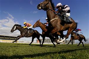 NEWBURY, ENGLAND - MARCH 06: David Noonan riding Umbrigado (L, yellow cap) get up on the run-in to win The BetVictor Greatwood Gold Cup Handicap Chase at Newbury Racecourse on March 06, 2021 in Newbury, England. Due to the coronavirus pandemic, owners along with the paying public will not be allowed to attend the meeting. (Photo by Alan Crowhurst/Getty Images)