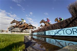 NEWBURY, ENGLAND - MARCH 06: A general view as runners clear the water jump during The BetVictor Greatwood Gold Cup Handicap Chase at Newbury Racecourse on March 06, 2021 in Newbury, England. Due to the coronavirus pandemic, owners along with the paying public will not be allowed to attend the meeting. (Photo by Alan Crowhurst/Getty Images)