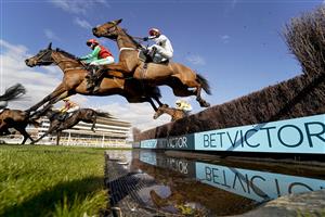 NEWBURY, ENGLAND - MARCH 06: A general view as runners clear the water jump during The BetVictor Greatwood Gold Cup Handicap Chase at Newbury Racecourse on March 06, 2021 in Newbury, England. Due to the coronavirus pandemic, owners along with the paying public will not be allowed to attend the meeting. (Photo by Alan Crowhurst/Getty Images)
