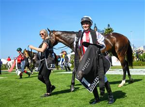 MELBOURNE, AUSTRALIA - MARCH 06: Luke Currie riding Zoutori and strapper Jadey Pietrasiewicz after winning in race 6, the Seppelt Wines Newmarket Handicap, during Melbourne Racing at Flemington Racecourse on March 06, 2021 in Melbourne, Australia. (Photo by Vince Caligiuri/Getty Images)
