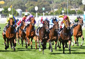 MELBOURNE, AUSTRALIA - MARCH 06: Luke Currie riding Zoutori defeating Brad Parnham riding Indian Pacific in race 6, the Seppelt Wines Newmarket Handicap, during Melbourne Racing at Flemington Racecourse on March 06, 2021 in Melbourne, Australia. (Photo by Vince Caligiuri/Getty Images)