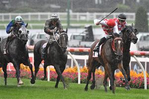 MELBOURNE, AUSTRALIA - MARCH 13: Teodore Nugent riding Air Defence winning Race 7, the Powerflo Solutions Vobis Gold Reef during Melbourne Racing All-Star Mile Day at Moonee Valley Racecourse on March 13, 2021 in Melbourne, Australia. (Photo by Vince Caligiuri/Getty Images)