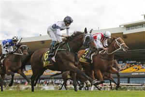 SYDNEY, AUSTRALIA - MARCH 13: Tom Marquand on Toffee Tongue (red/white) wins race 4 the Bisley Workwear Sky High Stakes during Sydney Racing at Rosehill Gardens on March 13, 2021 in Sydney, Australia. (Photo by Mark Evans/Getty Images)