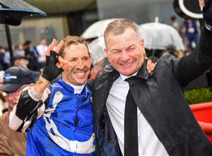 MELBOURNE, AUSTRALIA - MARCH 13: Trainer Kris Lees poses with Hugh Bowman after riding Mugatooto win Race 8, the All-star Mile, during Melbourne Racing All-Star Mile Day at Moonee Valley Racecourse on March 13, 2021 in Melbourne, Australia. (Photo by Vince Caligiuri/Getty Images)