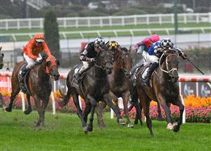 MELBOURNE, AUSTRALIA - MARCH 13: Hugh Bowman riding Mugatoo defeats Damien Oliver riding Russian Camelot in Race 8, the All-star Mile, during Melbourne Racing All-Star Mile Day at Moonee Valley Racecourse on March 13, 2021 in Melbourne, Australia. (Photo by Vince Caligiuri/Getty Images)