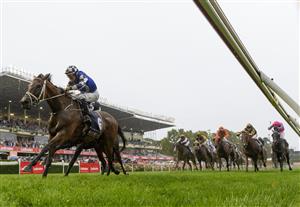 MELBOURNE, AUSTRALIA - MARCH 13: Hugh Bowman riding Mugatoo defeats Damien Oliver riding Russian Camelot in Race 8, the All-star Mile, during Melbourne Racing All-Star Mile Day at Moonee Valley Racecourse on March 13, 2021 in Melbourne, Australia. (Photo by Vince Caligiuri/Getty Images)