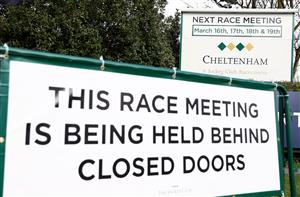 CHELTENHAM, ENGLAND - MARCH 16: A sign is seen outside the course displaying that the meeting is being held behind closed doors prior to Day One of the Cheltenham Festival at Cheltenham Racecourse on March 16, 2021 in Cheltenham, England. Sporting venues around the UK remain under strict restrictions due to the Coronavirus Pandemic as Government social distancing laws prohibit spectators inside venues resulting in events being held behind closed doors. (Photo by Michael Steele/Getty Images)
