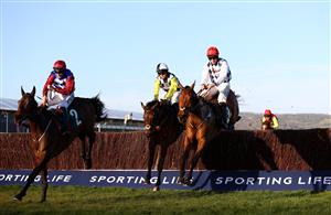 CHELTENHAM, ENGLAND - MARCH 16: Galvin (R) ridden by Jack Kennedy jumps the last to beat Next Destination (C) ridden by Harry Cobden and Escaria Ten (L) ridden by Adrian Heskin in the Sam Vestey National Hunt Challenge Cup Novices' Chase (Grade 2) on Day One of the Cheltenham Festival at Cheltenham Racecourse on March 16, 2021 in Cheltenham, England. Sporting venues around the UK remain under strict restrictions due to the Coronavirus Pandemic as Government social distancing laws prohibit spectators inside venues resulting in events being held behind closed doors. (Photo by Michael Steele/Getty Images)