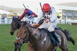 CHELTENHAM, ENGLAND - MARCH 16: Jack Kennedy riding Galvin (red cap) clear the last to win The Sam Vestey National Hunt Challenge Cup Novices' Chase at Cheltenham Racecourse on March 16, 2021 in Cheltenham, England. Sporting venues around the UK remain under strict restrictions due to the Coronavirus Pandemic as Government social distancing laws prohibit spectators inside venues resulting in events being held behind closed doors. (Photo by Alan Crowhurst/Getty Images)