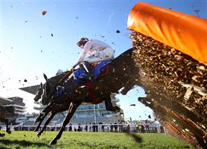 CHELTENHAM, ENGLAND - MARCH 16: Black Tears ridden by Jack Kennedy jumps a hurdle on the home straight first time round on the way to victory in the Close Brothers Mares' Hurdle (Grade 1) on Day One of the Cheltenham Festival at Cheltenham Racecourse on March 16, 2021 in Cheltenham, England. Sporting venues around the UK remain under strict restrictions due to the Coronavirus Pandemic as Government social distancing laws prohibit spectators inside venues resulting in events being held behind closed doors. (Photo by Michael Steele/Getty Images)