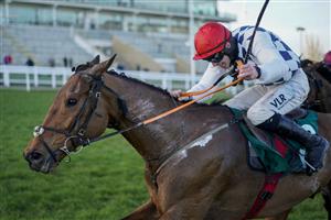 CHELTENHAM, ENGLAND - MARCH 16: Jack Kennedy riding Galvin (red cap) clear the last to win The Sam Vestey National Hunt Challenge Cup Novices' Chase at Cheltenham Racecourse on March 16, 2021 in Cheltenham, England. Sporting venues around the UK remain under strict restrictions due to the Coronavirus Pandemic as Government social distancing laws prohibit spectators inside venues resulting in events being held behind closed doors. (Photo by Alan Crowhurst/Getty Images)