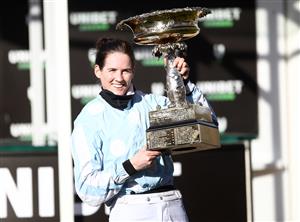 CHELTENHAM, ENGLAND - MARCH 16: Rachael Blackmore celebrates with the trophy after riding Honeysuckle to win the Unibet Champion Hurdle Challenge Trophyat Cheltenham Racecourse on March 16, 2021 in Cheltenham, England. Sporting venues around the UK remain under strict restrictions due to the Coronavirus Pandemic as Government social distancing laws prohibit spectators inside venues resulting in events being held behind closed doors. (Photo by Tim Goode - Pool/Getty Images)