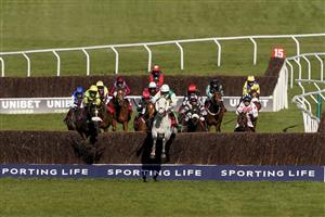 CHELTENHAM, ENGLAND - MARCH 16: Ryan Mania riding Vintage Clouds (grey horse) clear the last to win The Ultima Handicap Chase at Cheltenham Racecourse on March 16, 2021 in Cheltenham, England. Sporting venues around the UK remain under strict restrictions due to the Coronavirus Pandemic as Government social distancing laws prohibit spectators inside venues resulting in events being held behind closed doors. (Photo by Alan Crowhurst/Getty Images)