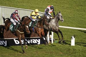 CHELTENHAM, ENGLAND - MARCH 17: Nick Scholfield riding Sky Pirate (yellow) clear the last to win The Johnny Henderson Grand Annual Challenge Cup Handicap Chase at Cheltenham Racecourse on March 17, 2021 in Cheltenham, England. Sporting venues around the UK remain under strict restrictions due to the Coronavirus Pandemic as Government social distancing laws prohibit spectators inside venues resulting in events being held behind closed doors. (Photo by Alan Crowhurst/Getty Images)