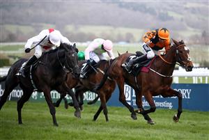 CHELTENHAM, ENGLAND - MARCH 17: Put The Kettle On ridden by Aidan Coleman (right) on their way to winning the Betway Queen Mother Champion Chase on day two of the Cheltenham Festival at Cheltenham Racecourse, on March 17, 2021 in Cheltenham, England. Sporting venues around the UK remain under strict restrictions due to the Coronavirus Pandemic as Government social distancing laws prohibit spectators inside venues resulting in events being held behind closed doors. (Photo by Tim Goode - Pool/Getty Images)
